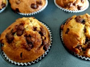 Close up image of chocolate muffins in the muffin tin.