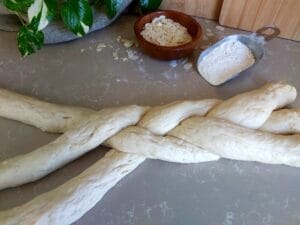 Three strands of dough braided into a braid