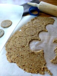 Cut-Out Quinoa Crackers on a baking parchment.
