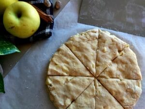 The dough shaped into a round disc and cut into 8 equal wedges.