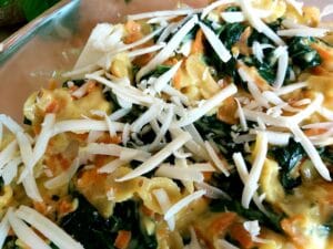 Prepared vegan Spinach Carrot Casserole in a baking dish ready for baking.