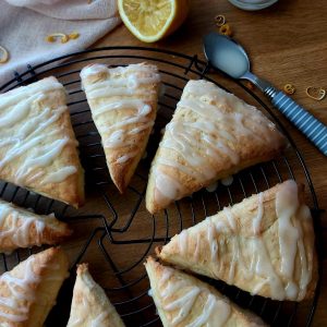 Lemon scone wedges on a wire rack.