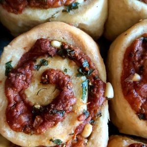 Close-up of freshly baked cheese and garlic rolls.